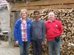 Vascille with Aodh & Maire in front of his wood supply for next Winter.