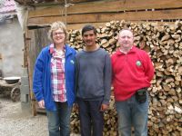 Vascille with Aodh & Maire in front of his wood supply for next Winter.