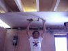 Dorel Ioji, the family's father gets to work on the ceiling.